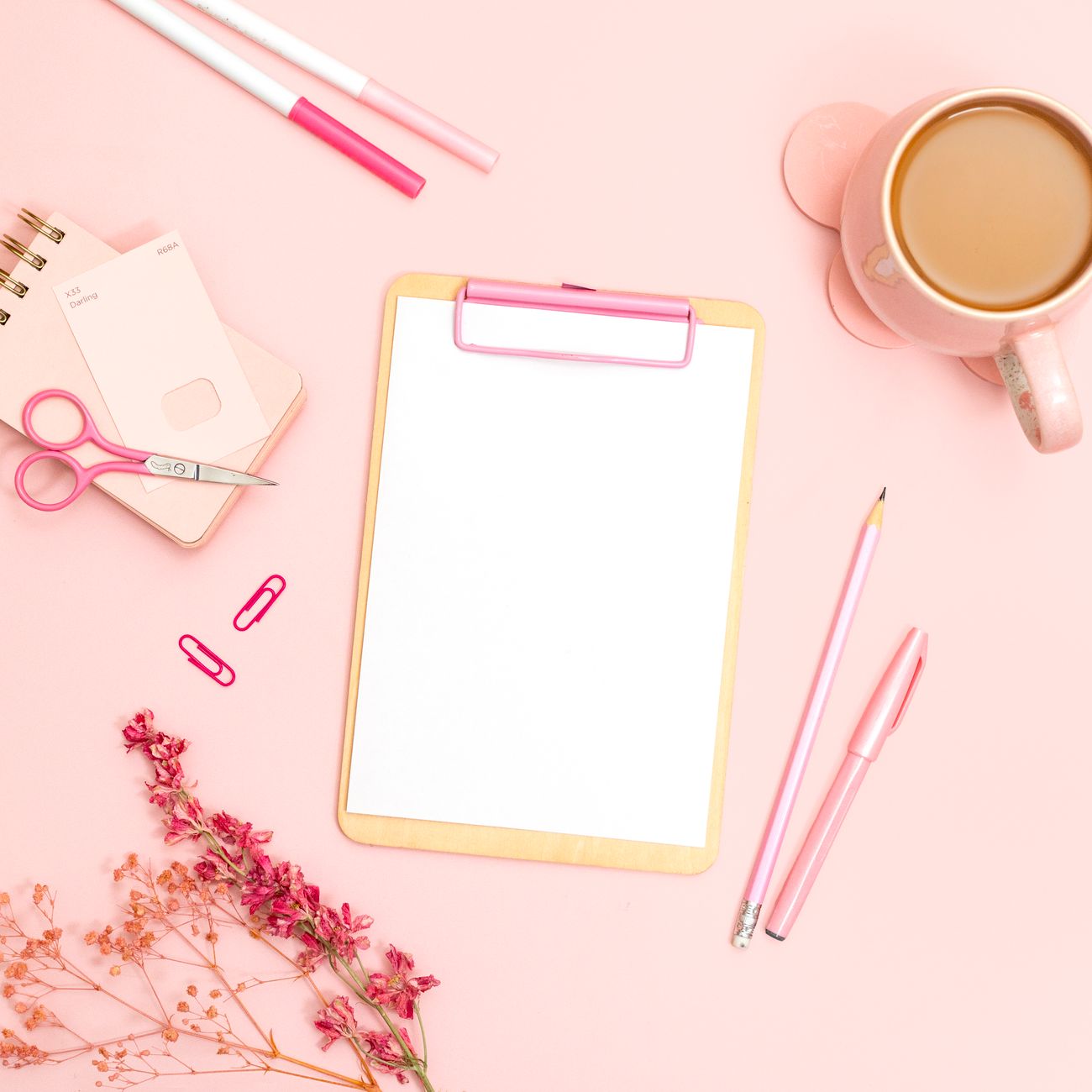 A family planning their weekly grocery budget together at a kitchen table with a shared shopping list.